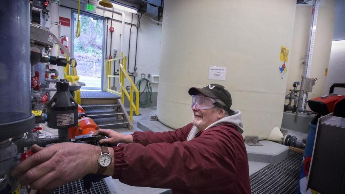 Tacoma Water quality mechanic Craig Carrara monitors sodium hydroxide added to water from ground wells at the Hood Street Reservoir Groundwater Treatment Facility. Sodium hydroxide helps raise PH in water to stave off corrosion in pipes.