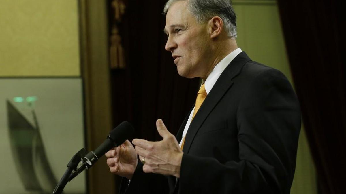 Washington Gov. Jay Inslee talks to reporters, late Thursday, March 10, 2016, at the Capitol in Olympia, Wash. On Tuesday, March 29, Inslee announced a ban on non-essential state-funded travel to North Carolina, citing the state’s new law concerning the rights of transgender individuals.