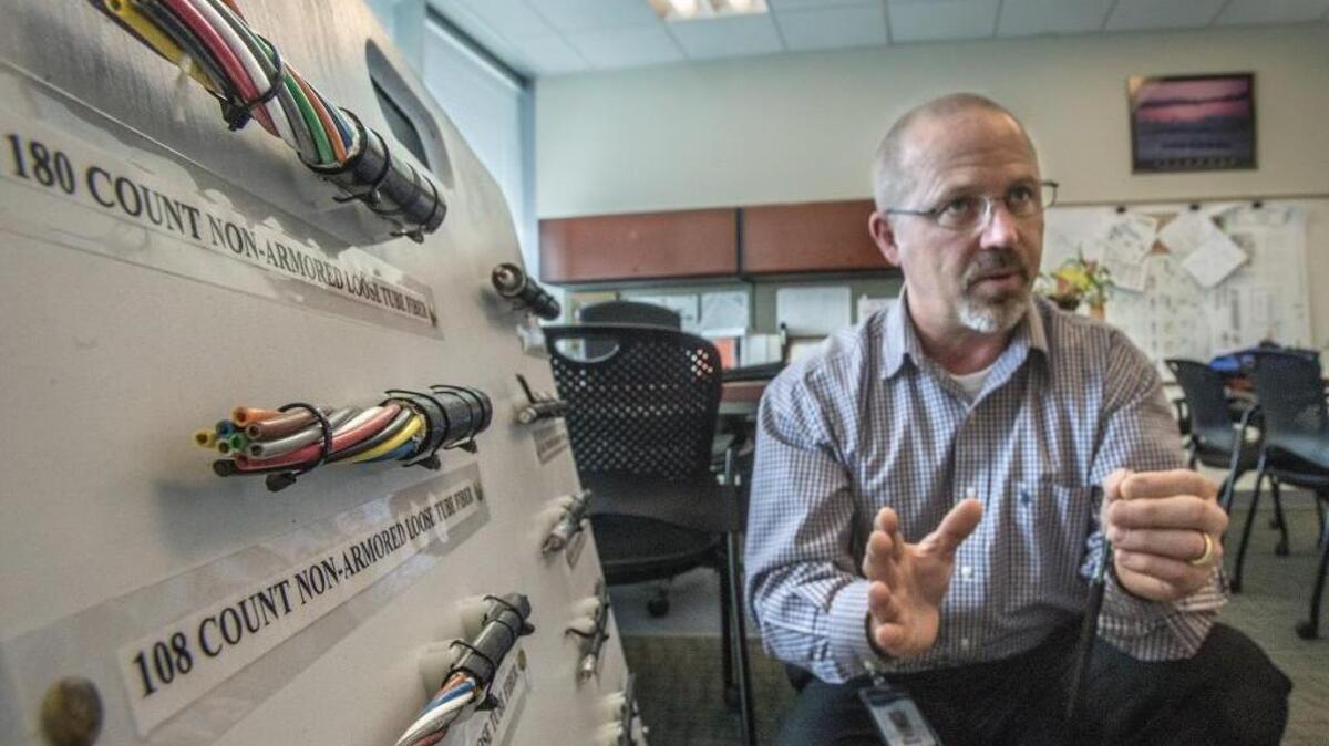 Pat Bacon, the Technical Operations Manager with Click Network talks about the company's fiber optic network in March at Tacoma Public Utilities offices.