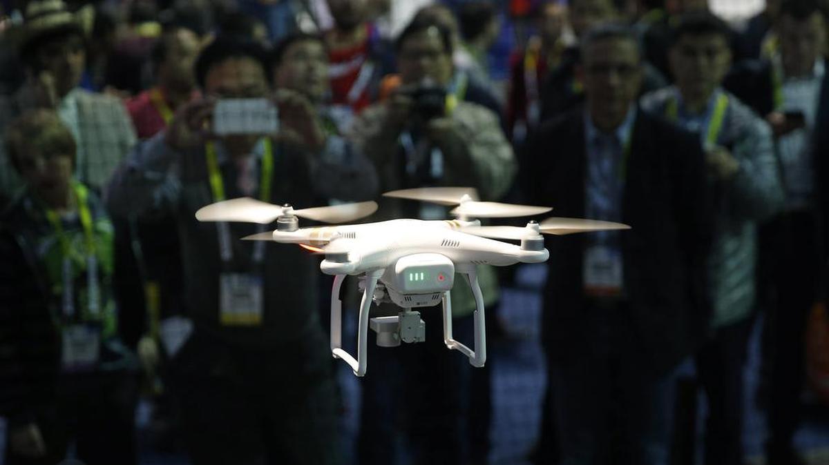 A drone hovers at the DJI booth during CES International, Thursday in Las Vegas.