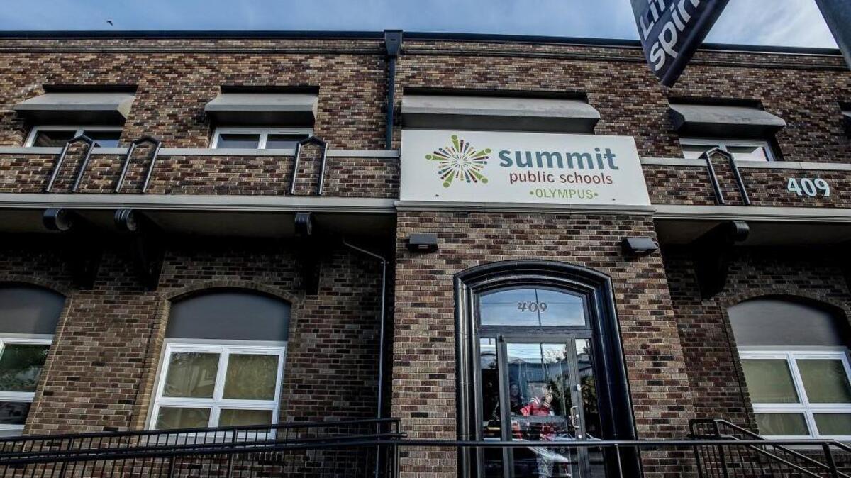
A student peers outside the front door of Summit Olympus, one of three charter schools in Tacoma. 
