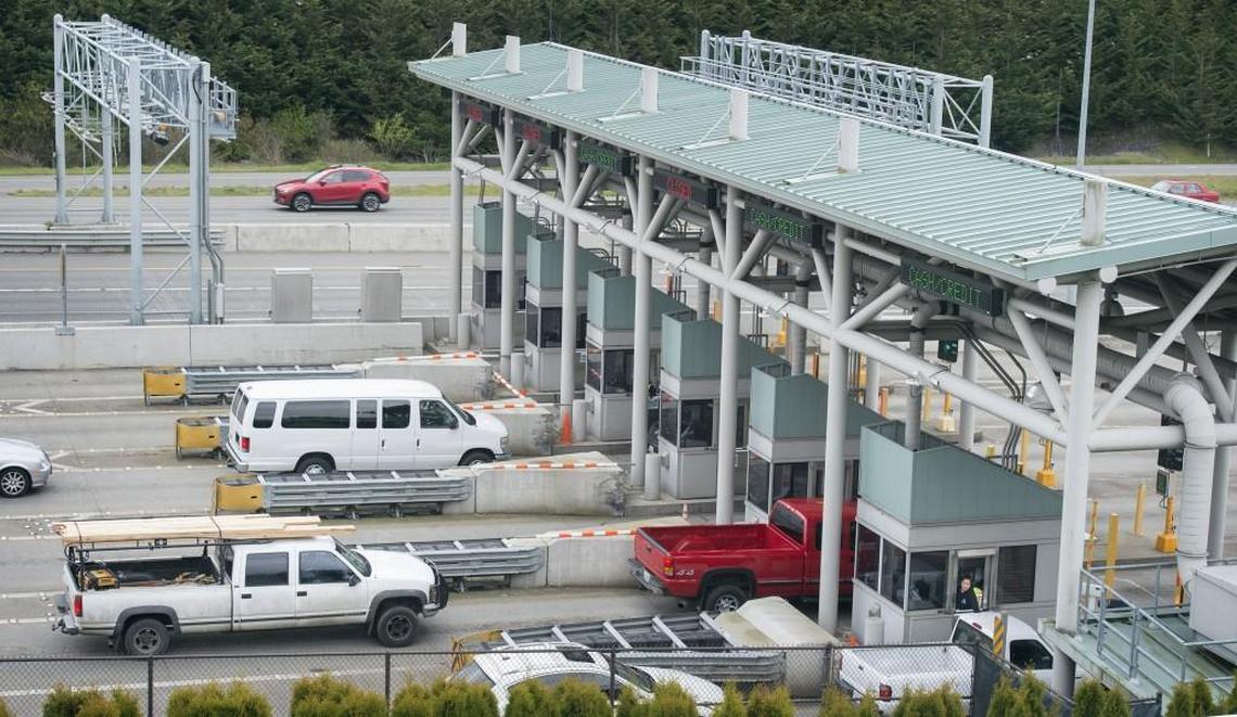 Drivers stop to pay the toll to cross the new Tacoma Narrows Bridge on Wednesday, March 28, 2018.
