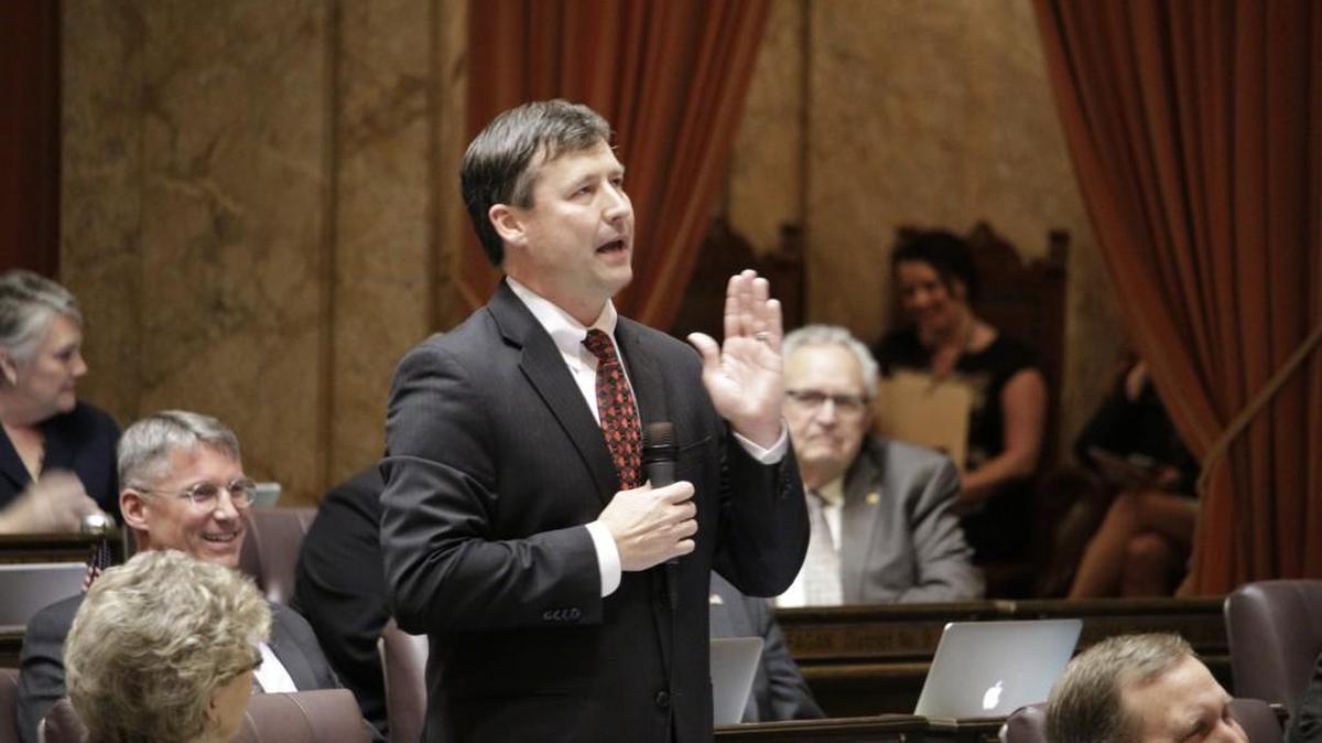 In this March 3, 2015 photo, Rep. Matt Manweller, R-Ellensburg, speaks on the House floor in Olympia against a bill to raise Washington state's minimum wage. Manweller, who is facing scrutiny over past allegations of sexual harassment, has been removed from his ranking member position on a House committee, and has resigned his position as assistant floor leader, House leaders said Thursday, Dec. 14, 2017.