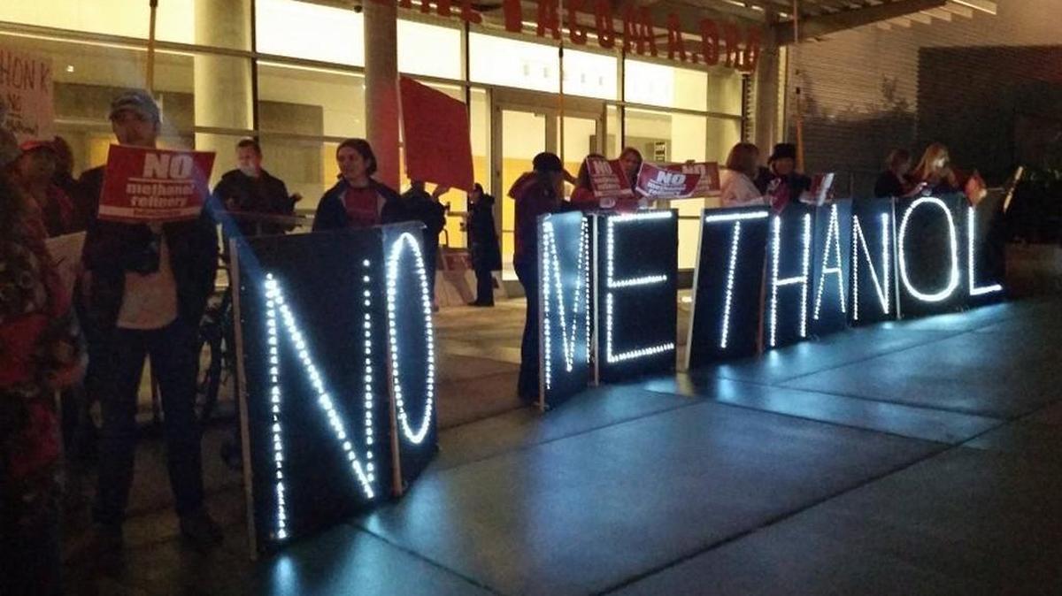 Protesters gather outside the Greater Tacoma Convention & Trade Center before a hearing about a proposed methanol plant being build in Tacoma.