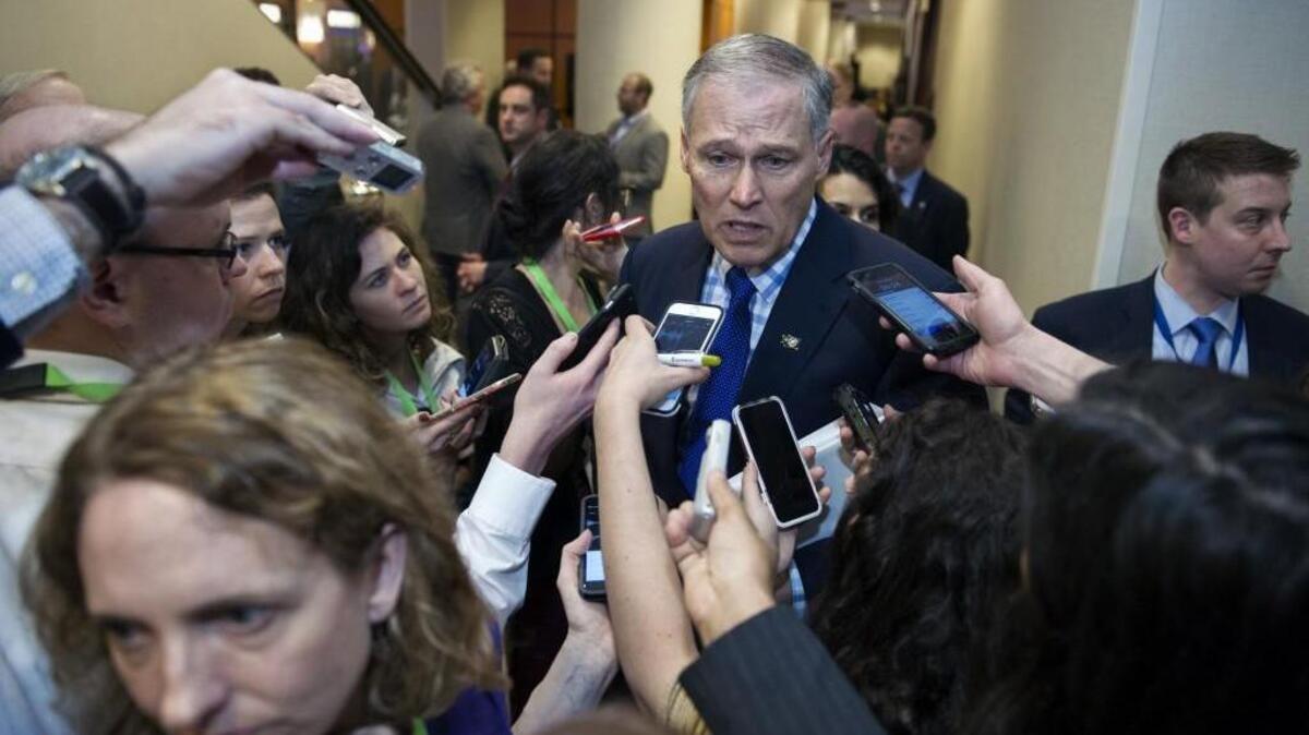 As Gov. Jay Inslee presses an ambitious carbon-tax plan for Washington state, two of his climate-change policy advisers are drawing attention. One works remotely from Morocco, while the other’s job is funded through a grant by the World Resources Institute.