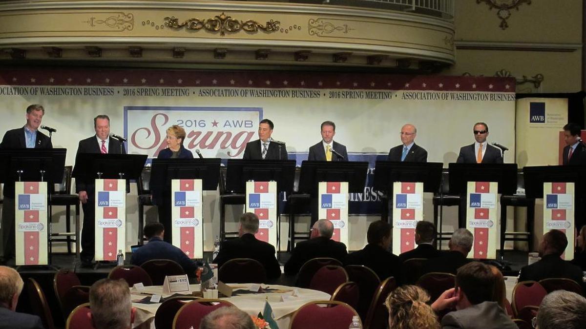 In this photo taken June 14, eight of the 11 candidates for Washington lieutenant governor take part in a debate in Spokane, Wash. From left, Marty McClendon, Paul Addis, Sen. Karen Fraser, D-Olympia, Sen. Steve Hobbs, D-Lake Stevens, Bill Penor, Javier Figueroa, Sen. Cyrus Habib, D-Bellevue, and Phillip Yin, all stand at their podiums.