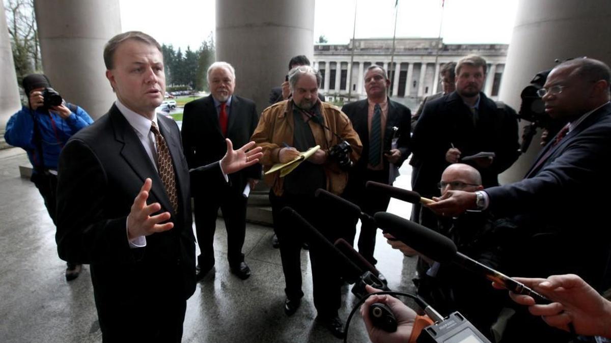 Tim Eyman stands at the entrance to the Legislative Building on Feb 28, 2013.