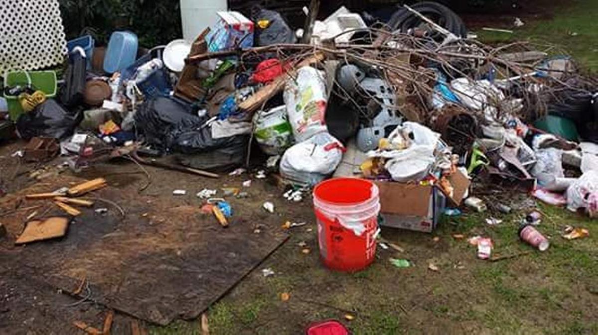 Trash outside a house owned by Tacoma resident Rose Nelson, who said she had to use community pressure to get squatters off her property. A new bill signed last week seeks to make it easier for property owners to evict squatters.