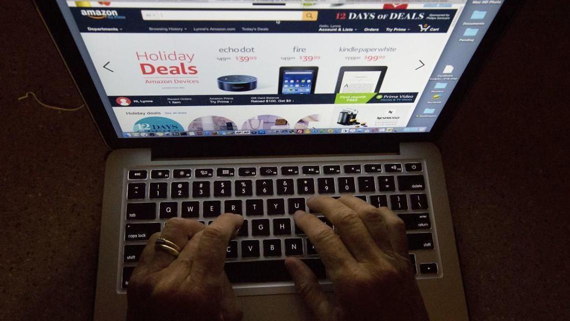 A shopper in Miami searches an online retail site. The Legislature is considering a state tax on online shopping.
