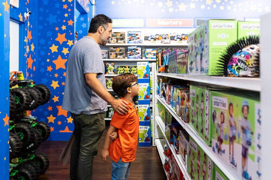 A Toys "R" Us flagship store is shown.