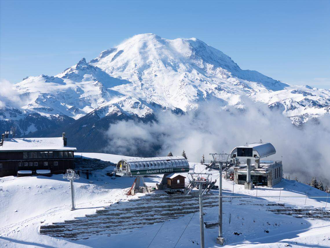 Crystal Mountain’s new Rainier Express top terminal is shown, with Mount Rainier in the back.