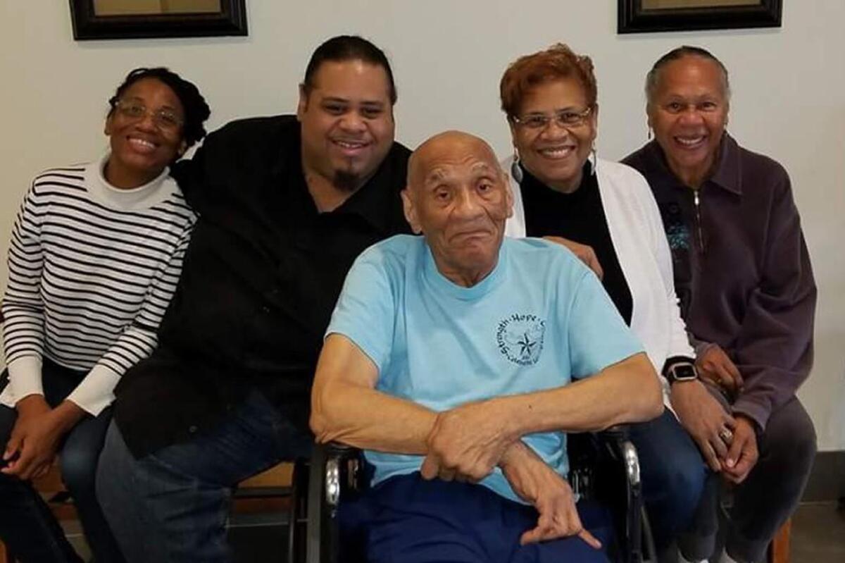 Kenneth Bowser, middle, visits with, from left, grandchildren Tonya Cotton and Mark Cotton and daughters Sharon Van Leer and Janet Bowser at a locked forensic nursing home in St. Peter, Minn., in 2016. He was sent to the home after he fatally shot his son and caretaker, Larry, in 2015, and was deemed unfit to stand trial because of his dementia. (Courtesy of Sharon Van Leer/TNS)