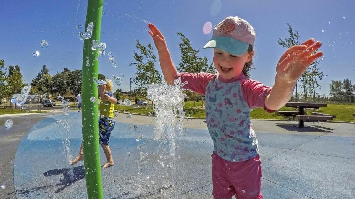 Freyja White, 4, delights while playing in the spray park at Tacoma Parks’ South End Recreation Center in May. Temperatures are expected to soar into the upper 80s and low 90s by the end of this week, peaking Friday and staying warm through early next week.