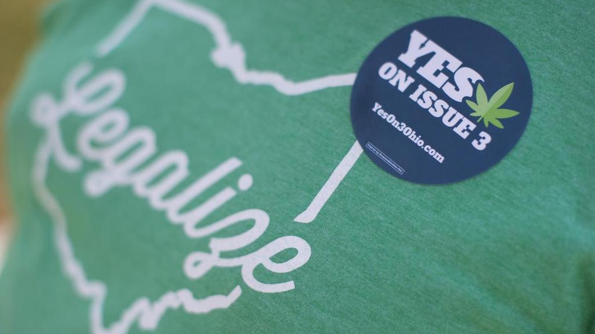 A representative from ResponsibleOhio, a pro-marijuana legalization group, wears a sticker during a promotional tour stop in October at Miami University in Oxford, Ohio. A ballot proposal before Ohio voters to make marijuana use and sales legal for both personal and medical use failed at the polls Tuesday.