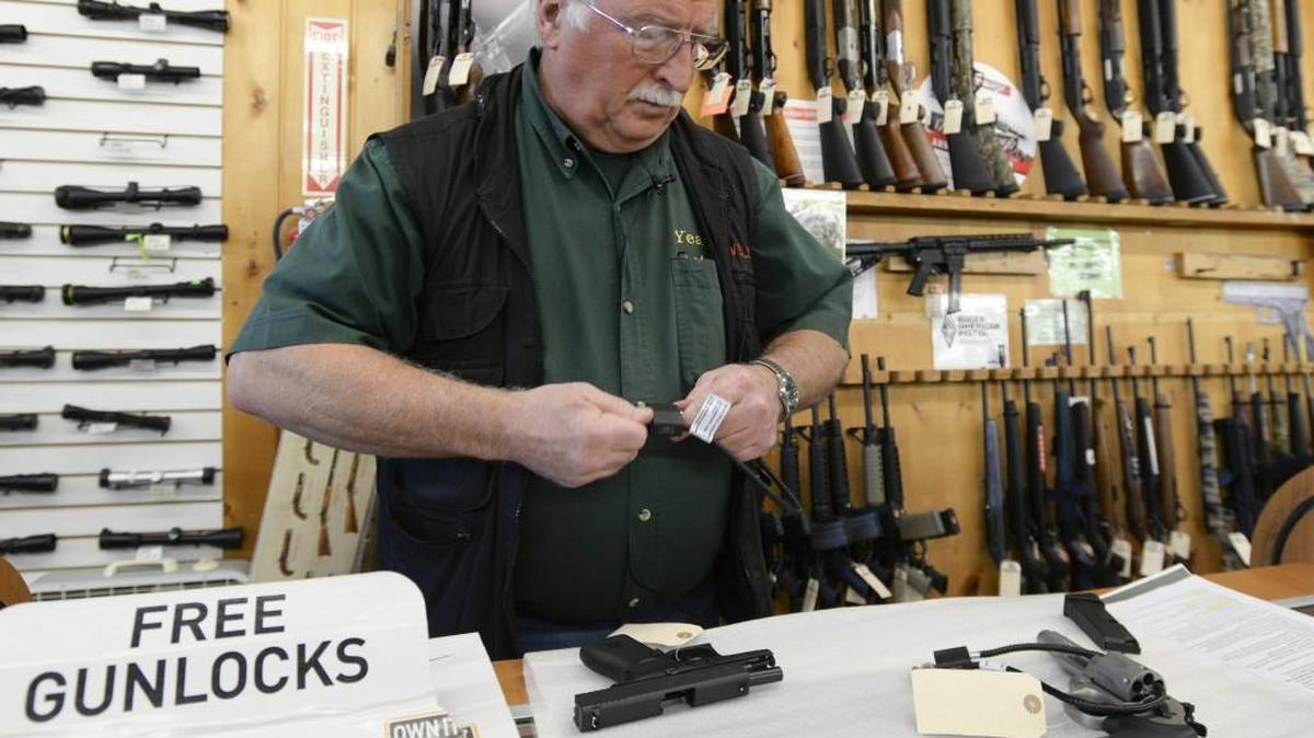 A new law mandates gun dealers like John "Westy" Westerfield, vice president and general manager of Yeager's Sporting Goods in Bellingham, alert law enforcement on all failed gun purchases. 2016.