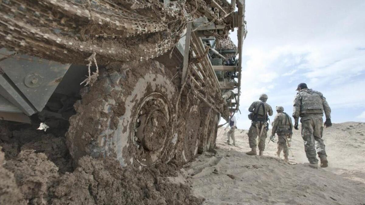 Stuck in Afghanistan? A JBLM Stryker vehicle had to be towed out after it sank in wet earth in Zabul Province during a deployment in April 2012. President Trump recommitted U.S. troops to the 16-year war in Afghanistan during a speech in Arlington, Virginia Monday night.