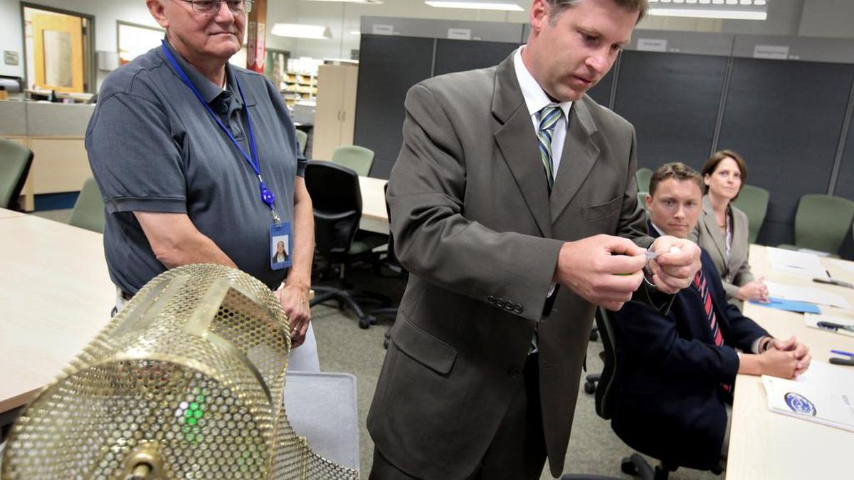And the winner is! ... After spinning a raffle drum, Pierce County Councilman Dan Roach reads aloud the name of a new precinct committee officer during a lot drawing at the Election Center in Tacoma. The 2012 contest was tied between two candidates after a mandatory hand recount, and was settled in a manner more familiar to a bingo hall. Could it happen again this year? Only 7 votes separate candidates for Sumner City Council Pos. 7, while 76 votes separate candidates for Bethel School District Pos. 2.