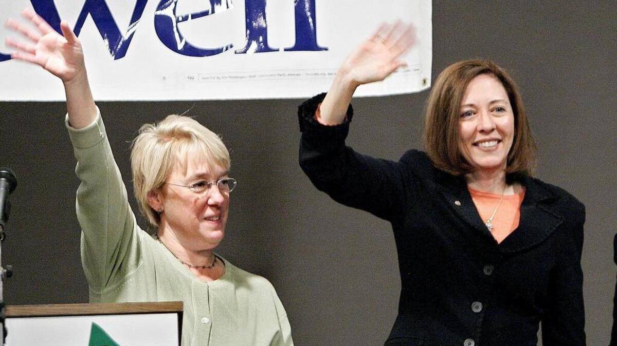 U.S. Senators Patty Murray (left) and Maria Cantwell flash their Five Spot greetings at a Democratic rally before Cantwell’s first reelection victory in 2006. She was recently crowned ... er, reelected ... to a fourth term.
