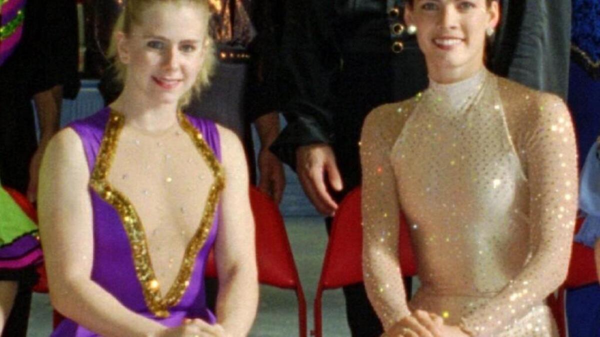 U.S. figure skaters Tonya Harding (left) and Nancy Kerrigan pose during a photo session at the U.S. Figure Skating Championships in Detroit on Jan. 8, 1994.