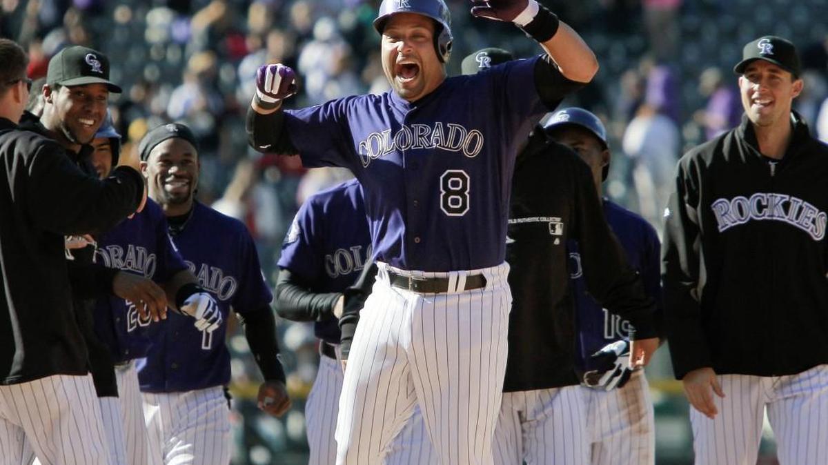 Colorado Rockies catcher Yorvit Torrealba (8) celebrates his twelfth-inning hit that scored a teammate to defeat the Atlanta Braves in 2013. The Venezuelan moved his family to Parkland, Florida, to escape Central American violence, only to see that community suffer a devastating school shooting this week.