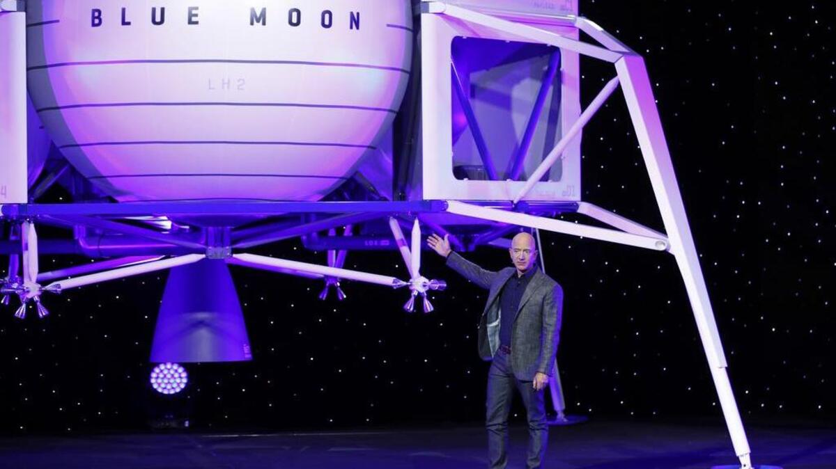 Jeff Bezos speaks in front of a model of Blue Origin’s Blue Moon lunar lander Thursday in Washington, D.C. Could a resemblance to Capt. Jean-Luc Picard from the “Star Trek” franchise have something to do with Bezos’ extraterrestrial interests?