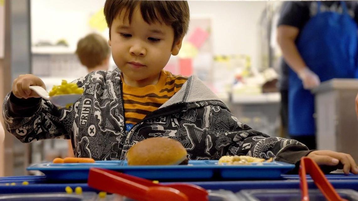 First grader Julian Breaux-Salazar helps himself to a healthy breakfast.