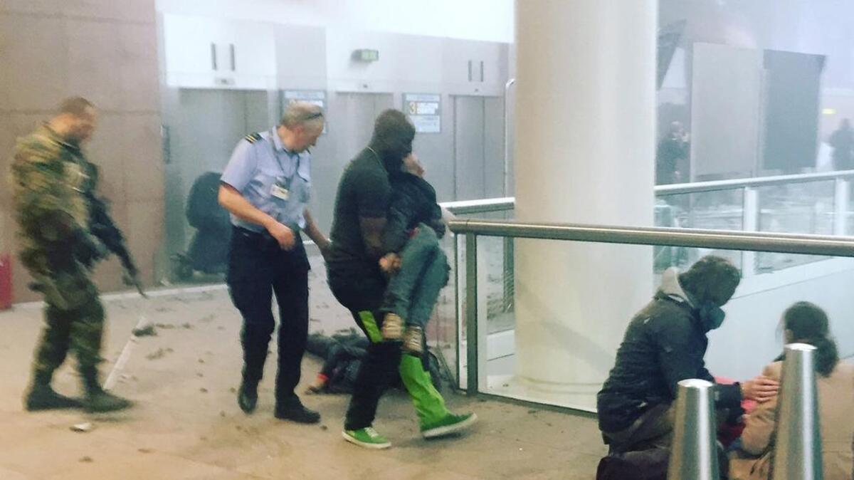 This photo provided by Georgian Public Broadcaster and photographed by Ketevan Kardava, shows the scene in Brussels Airport in Belgium after explosions were heard Tuesday.