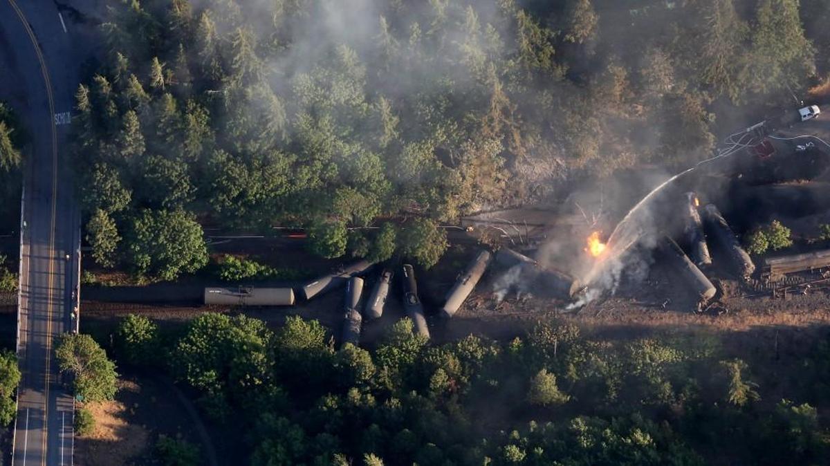 An oil train burns near the Oregon town of Mosier after derailing Friday, June 3.