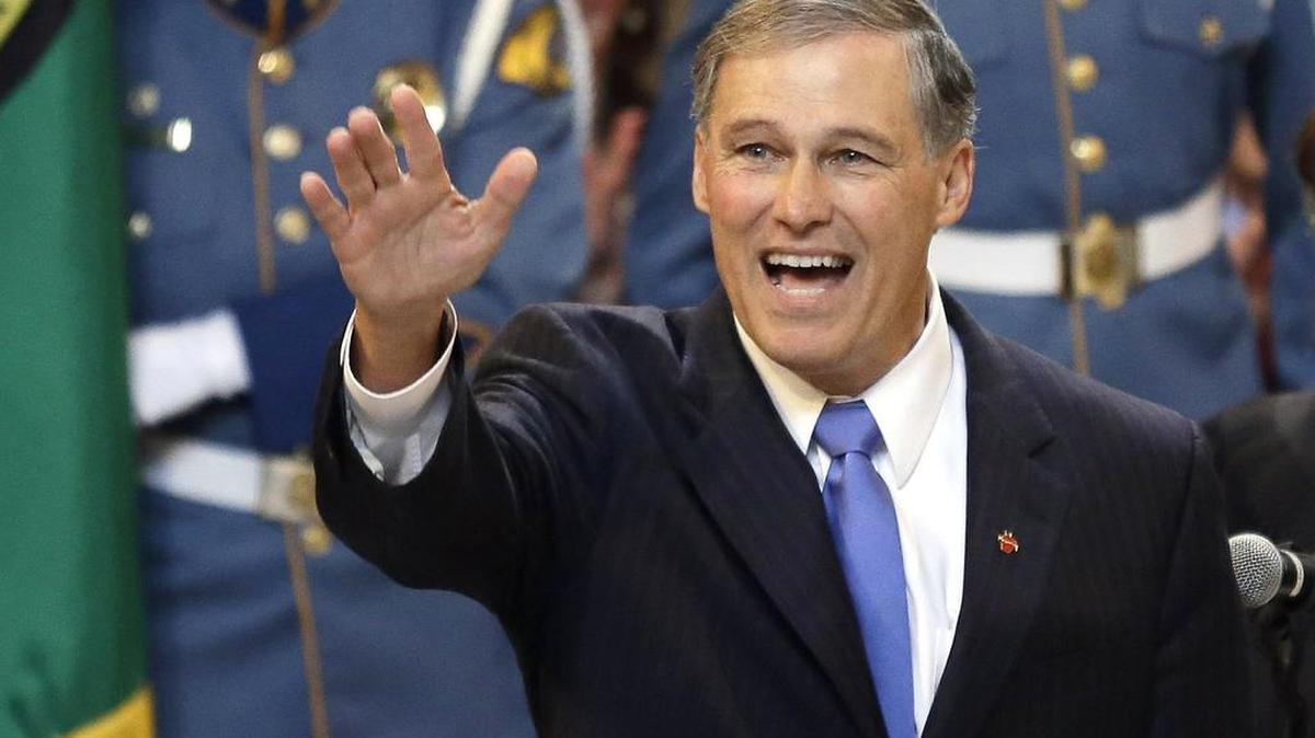 Jay Inslee gives a Five Spot salute after being sworn in as Washington state governor in 2013. Will he have reason for similar exuberance in 2020?