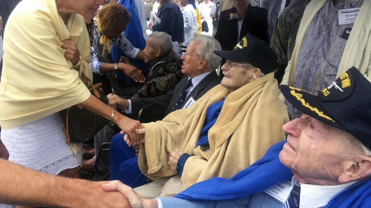Visitors appreciatively greet survivors attending ceremonies marking the 75th anniversary of the Battle of Midway that were held in June aboard a retired U.S. Navy aircraft carrier named for the epic World War II battle. Looking back to 1942 and 1992 might offer some Thanksgiving Day insights for Puget Sound residents.