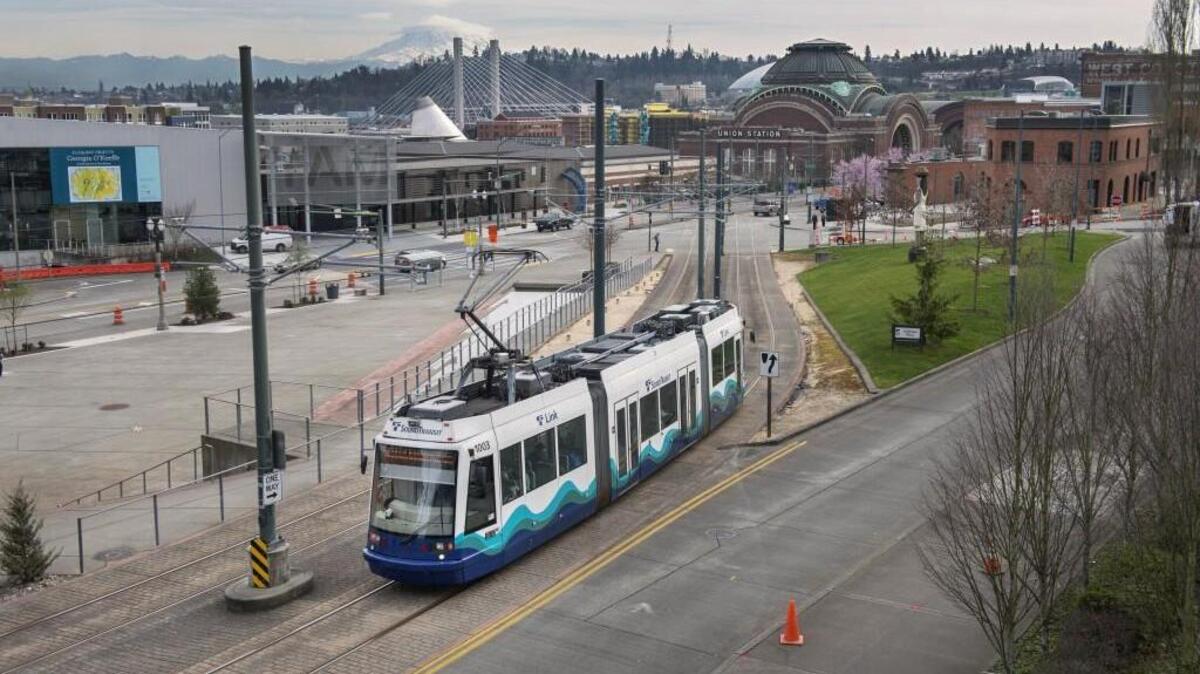 A Link light rail car heads toward Pacific Avenue from Commerce Street in downtown Tacoma in 2015. Link currently runs a limited route through downtown Tacoma. Eventually, light rail will extend between Tacoma, Seattle, Everett and East King County.