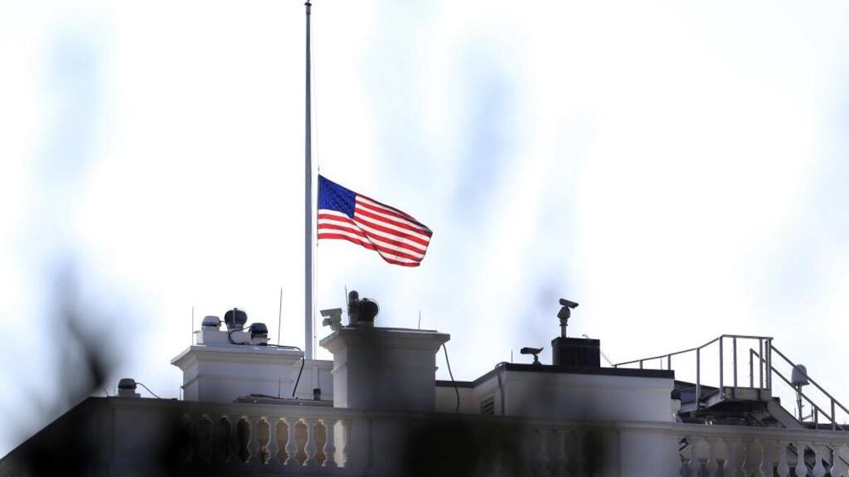 The U.S. flag is lowered to half-staff at the White House Tuesday morning to honor the victims killed in the June 28 shooting at the Capital Gazette newspaper in Annapolis, Maryland.