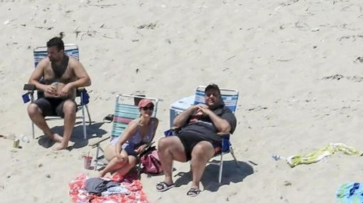 At least Washington state lawmakers don’t have to worry about embarrassing episodes like this. New Jersey Gov. Chris Christie, right, uses the beach with family and friends Sunday at the governor's summer house at Island Beach State Park in New Jersey, despite a government shutdown that closed the beach to the public. Washington lawmakers, by contrast, have passed a budget — although the eleventh-hour, non-transparent way they did it is an embarrassment all its own.