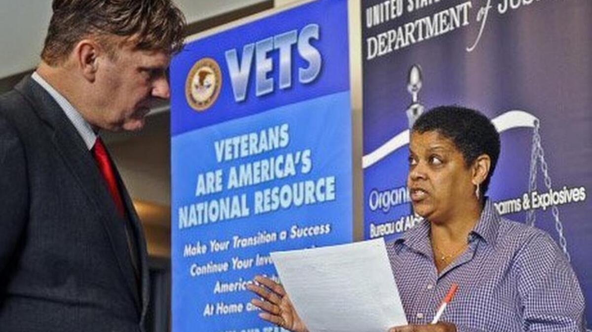 A veteran speaks with a Department of Justice representative during a 2012 job fair in Washington, D.C. In 2015, 47.4 percent of new hires to full-time federal jobs were veterans.