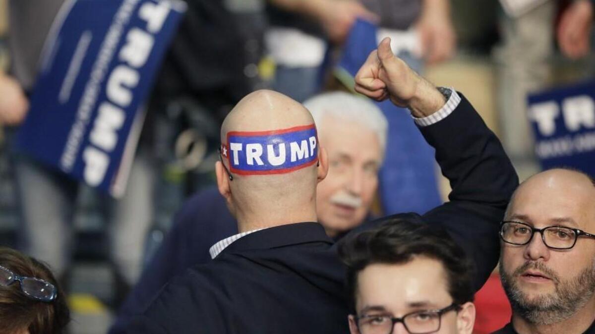 A supporter displays his support before Republican presidential candidate Donald Trump speaks during a rally at Macomb Community College Friday in Warren, Michigan.