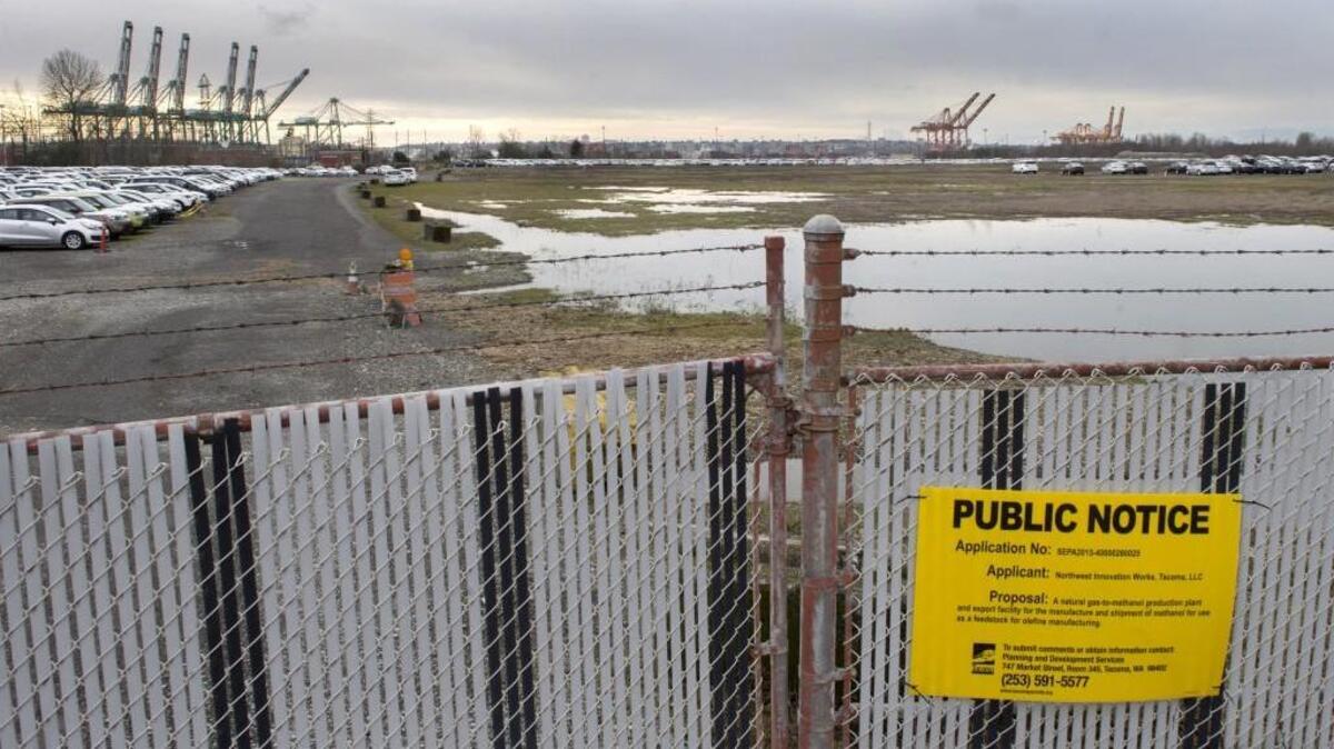 Public notification of Northwest Innovation Works' application to build a methanol production facility is posted outside the gates of the former Kaiser Aluminum property. The Port of Tacoma bought and cleaned up the property after the smelter halted work more than a dozen years ago. In 2014, Northwest Innovation Works signed a 30-year lease with the port to build a proposed 125-acre methanol production facility on the property.
