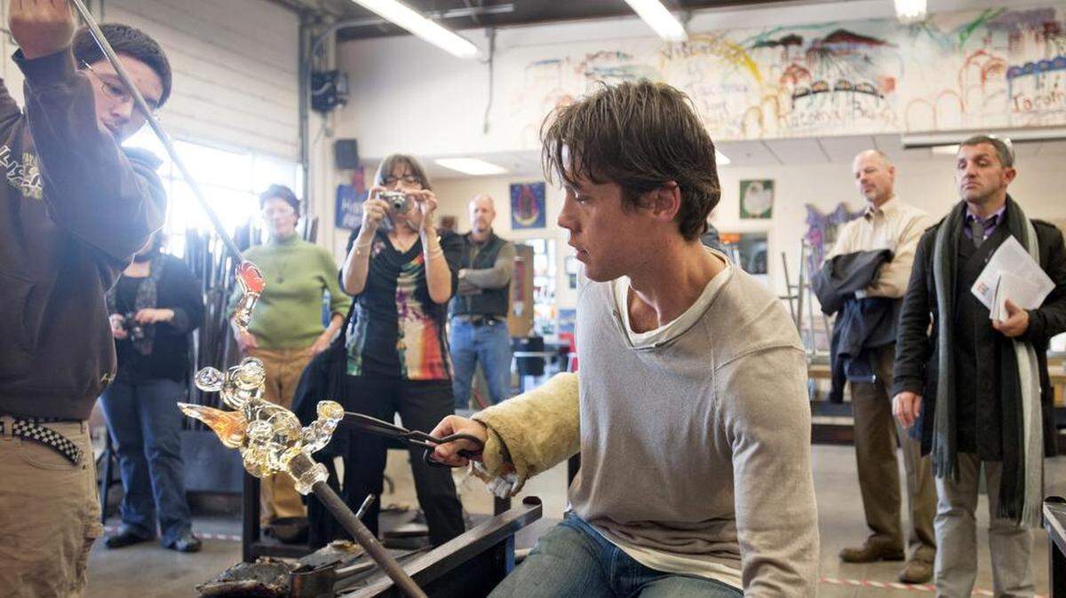 French glass artist Antoine Pierini gets some assistance from Ryan Eubank of Hilltop Artists (left) during a visit to Jason Lee Middle School’s hot shop. Hilltop Artists is just one organization that could expand deeper into Tacoma neighborhoods if a sales-tax measure on the November ballot is approved.