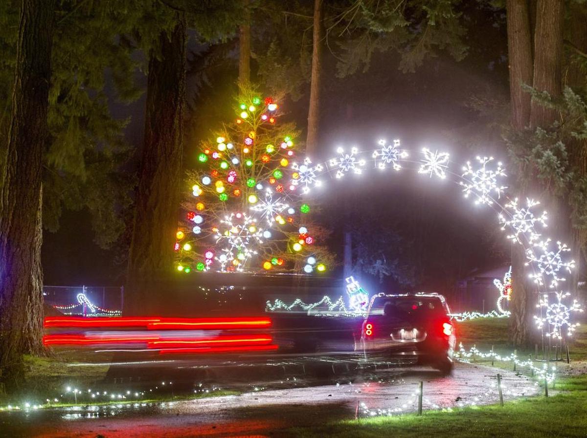 Cars slowly move through Pierce County's Fantasy Lights in Spanaway Park in December 2014.
