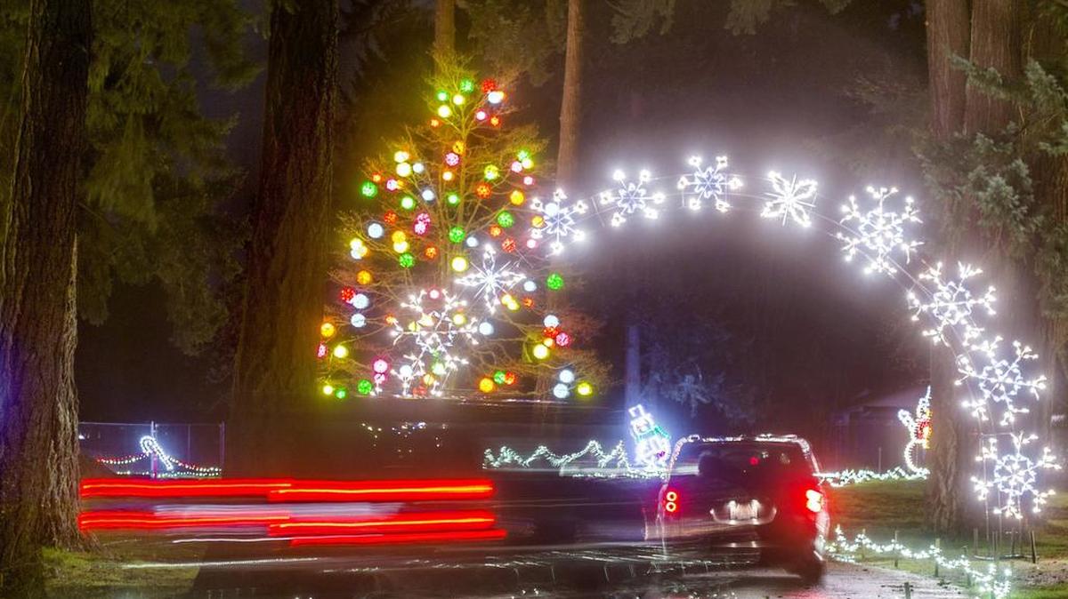 Cars slowly move through Pierce County's Fantasy Lights in Spanaway Park in December 2014. The annual South Sound tradition was cut short in 2025 as weather and electrical troubles led Pierce County Parks to shut the display down as of Dec. 19.