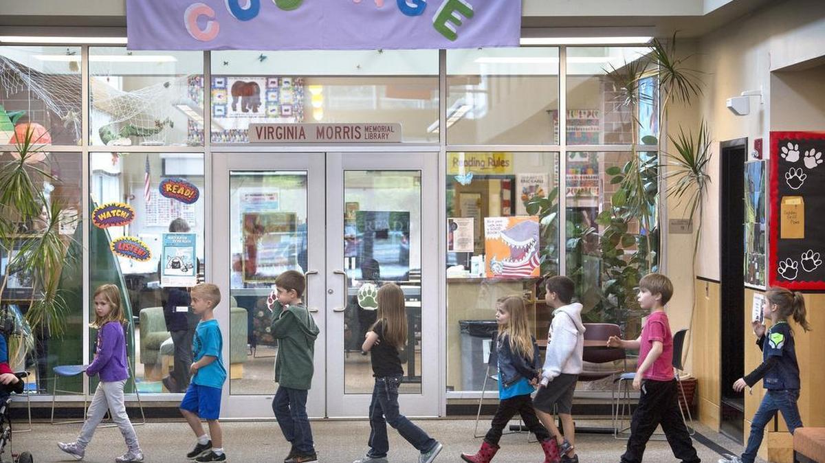 Students pass the library at Griffin School on Steam-boat Island Road in October 2015. School funding will be a top issue in the next legislative session.