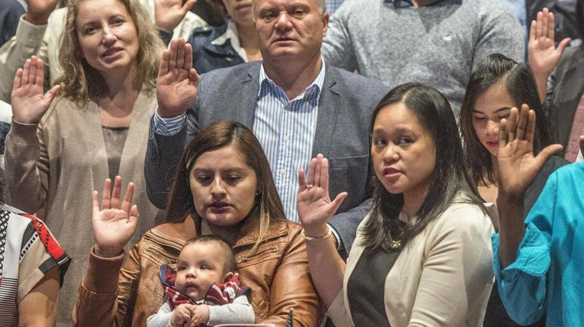 New American citizens raised their hands to swear allegiance to the U.S. during a naturalization ceremony in 2016 at Mount Tahoma High School. That was the last time the ceremony was held here.