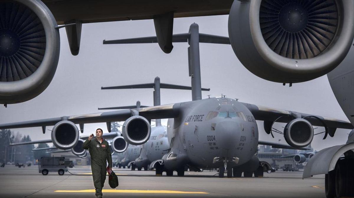 Lt. Col. Nathan Campbell checks over a C-17 at Joint Base Lewis-McChord in January.