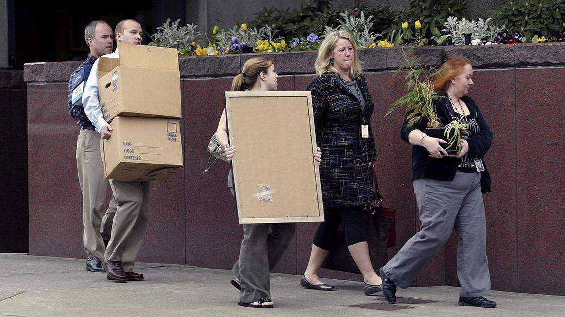 The iconic 2009 image of employees exiting the Russell Investments building with their possessions after being notified their jobs were leaving Tacoma illustrates Pierce County's ongoing struggle to recruit and retain living-wage jobs.