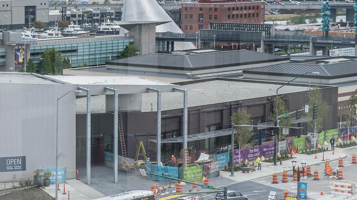The nearly complete Haub wing of the Tacoma Art Museum is shown in September 2014 amid the architectural tableau of downtown Tacoma, including the Museum of Glass hot shop cone in the background. TAM will grow again in the next few years to display its new Benaroya family gift of art pieces.