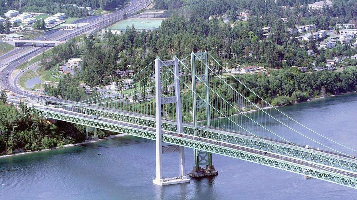 Walkers and bikers can traverse the Tacoma Narrows Bridge, which is a little over a mile in length from one end to the other. The bridge is on the west side of Tacoma and connects to Gig Harbor.