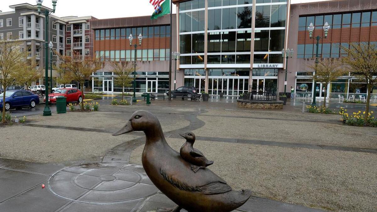 University Place’s Village at Chambers Bay includes the civic building, library and commercial development, including apartments, eateries and a Whole Foods.