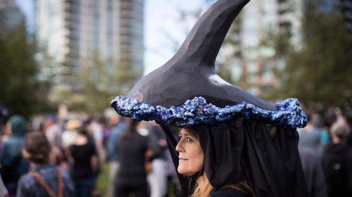 Karen Hale wears the likeness of an orca whale and a veil on her head during a protest against Kinder Morgan's proposed Trans Mountain pipeline expansion, in Vancouver, British Columbia, last week. Canada's federal government said it's buying the controversial pipeline from the Alberta oil sands to the Pacific Coast to ensure it gets built.