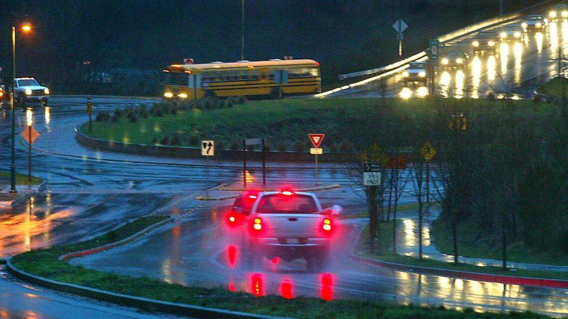 Morning traffic flows on a roundabout near the Burnham Drive exit in Gig Harbor, a gateway to the north part of the city where there’s much new development but no elementary school.
