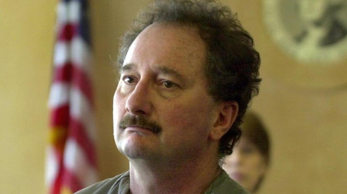 
Larry Shandola leaves Pierce County Superior Court in January 2001 after he was arraigned and charged with killing Tacoma businessman Robert Henry in 1995. 

