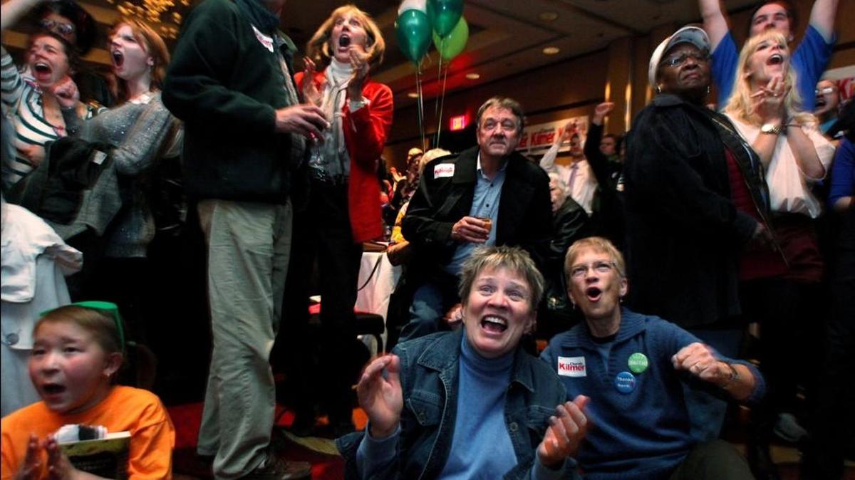 A crowd of Democrats celebrates the announcement that President Obama is projected to win reelection at a November 2012 party at the Murano Hotel in Tacoma. This year’s presidential race is wide open, but Washington state’s late primary date means voters get little chance to shape the ticket.